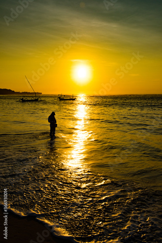 Bali Beach Fisherman at Sunset © liannaphoto