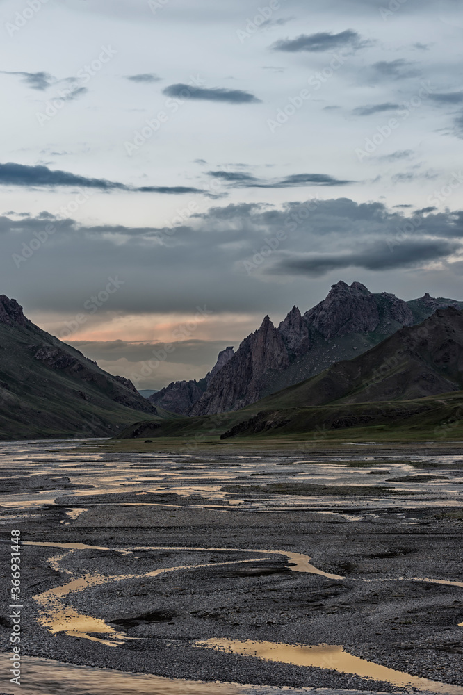 River coming from Köl-Suu mountain range at sunset, Kurumduk valley, Naryn province, Kyrgyzstan, Central Asia