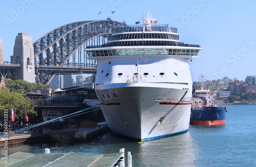 Cruise ship moored at the overseas passenger terminal in Sydney Harbour Circular Quay. The harbour bridge in the background photo