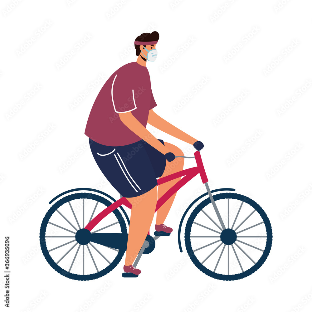 young man wearing medical mask in bicycle young man wearing medical mask in bicycle