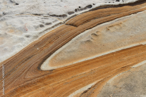 Sandstone rock formation by the ocean. © Rose Makin