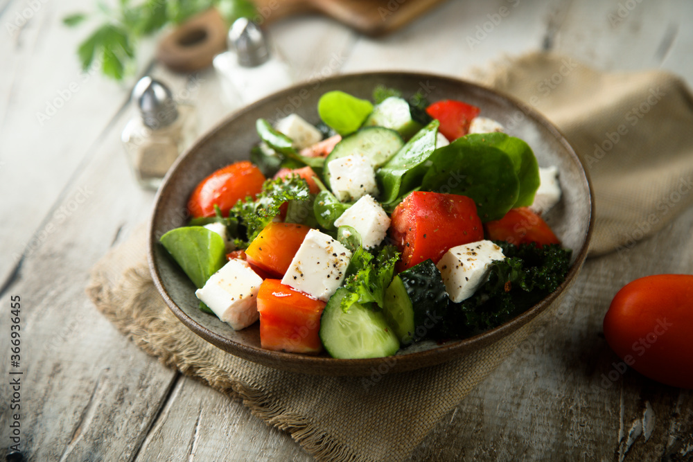 Traditional Greek salad with fresh spinach Traditional Greek salad with fresh spinach