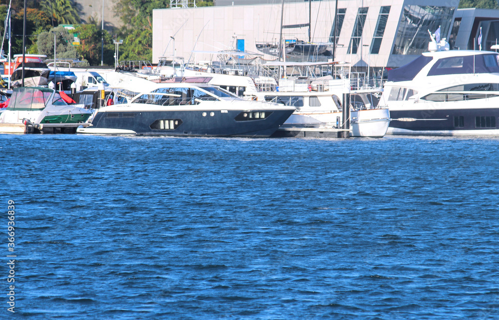 Seascape of Motor cruising yachts docked at a marina water in the foreground. Sydney 