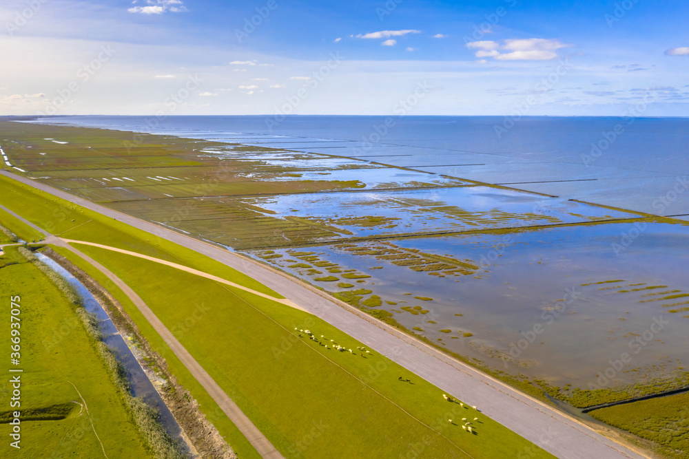 Fototapeta premium Aerial view sea dike Waddensea