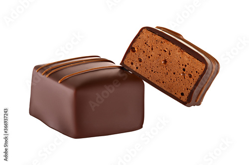 Luxury artisan souffle candy in chocolate with chocolate fillings. Chocolate candy bird's milk isolated on white