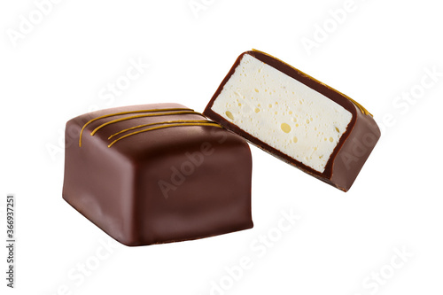 Luxury artisan souffle candy in chocolate with vanilla fillings. Chocolate candy bird's milk isolated on white