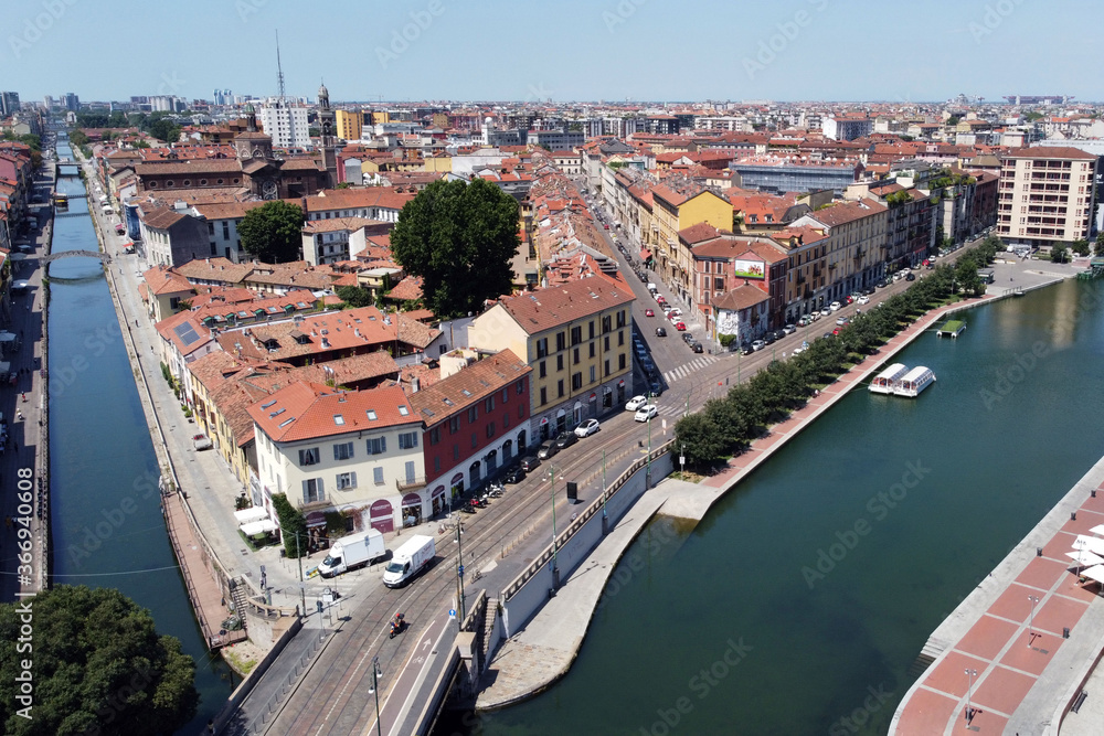 Europe, Italy, Milan July 2020 - drone aerial view of Darsena and Navigli canals waterway after Covid-19 Coronavirus lockdown - downtown without tourist who visit the city 