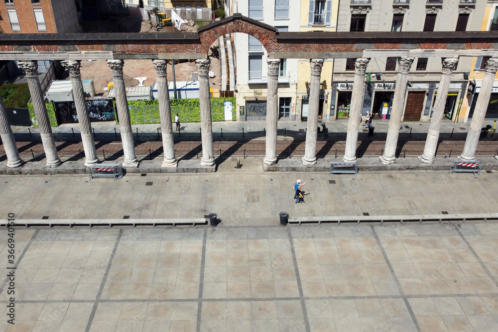 Fototapeta premium Europe, Italy, Milan July 2020 - drone aerial view of San Lorenzo column and basilica after Covid-19 Coronavirus lockdown - downtown without tourist who visit the city 