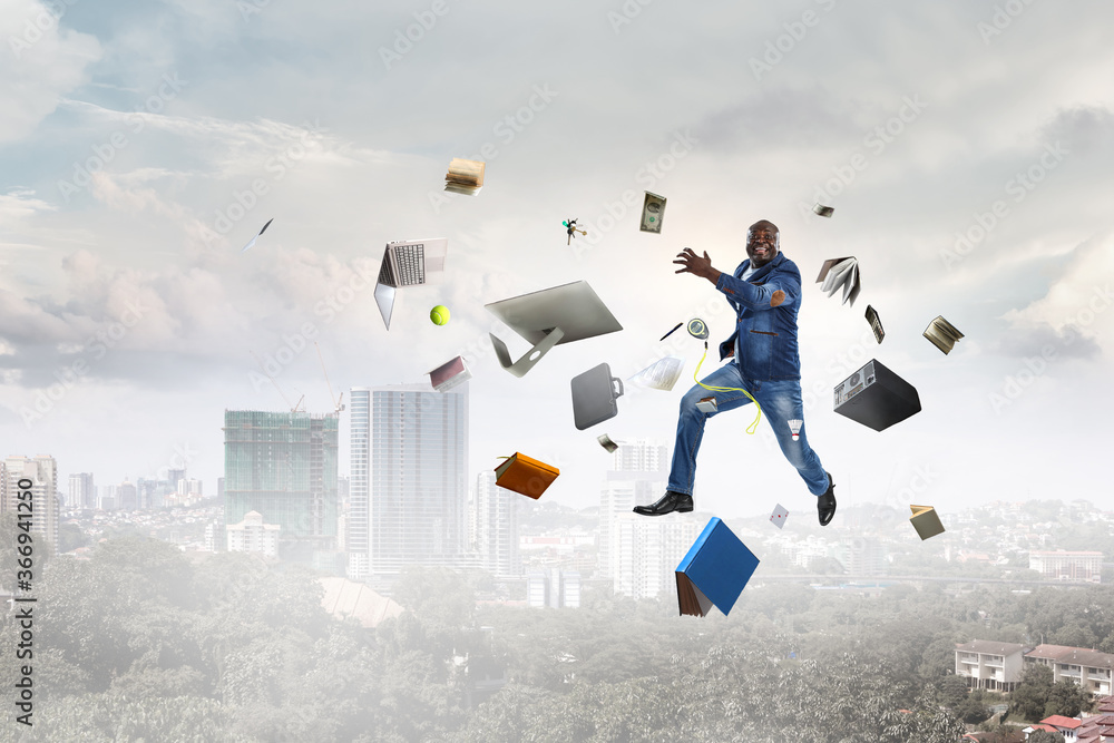 Businessman jumping high in the air Businessman jumping high in the air