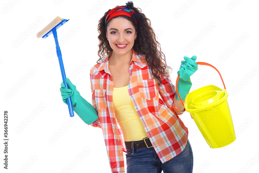 A beautiful European girl holding cleaning tools in her hand. A housewife. A beautiful European girl holding cleaning tools in her hand. A housewife.
