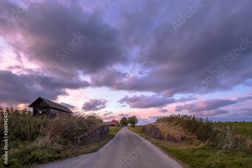 Road passage through dike photo