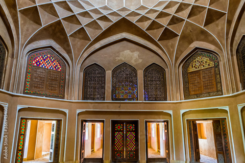 Pavilion under the wind catcher and colourful stained glass windows, Dolat Abad Garden, Yazd, Iran photo