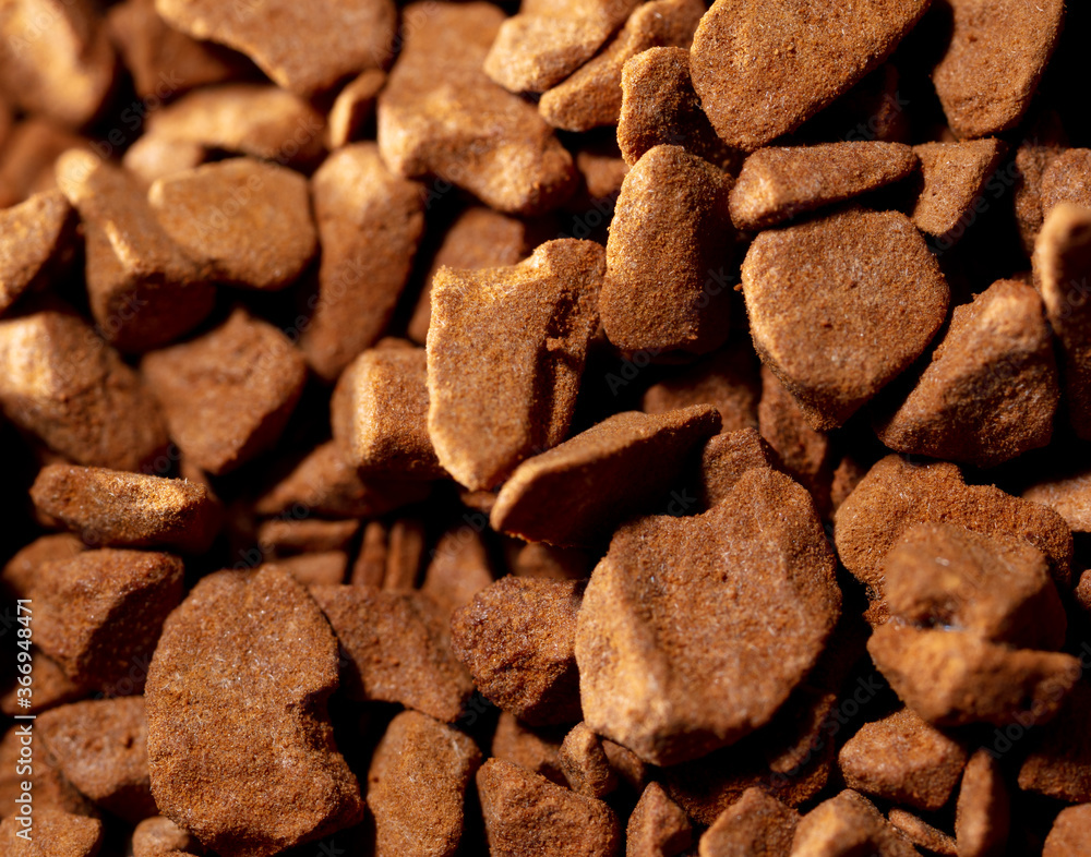 Close up of instant coffee granules as background. Close up of instant coffee granules as background.