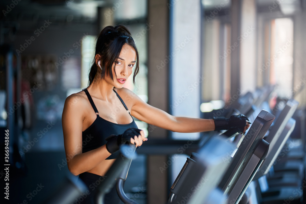 Fitnesswoman doing cardio in gym. Fitnesswoman doing cardio in gym.