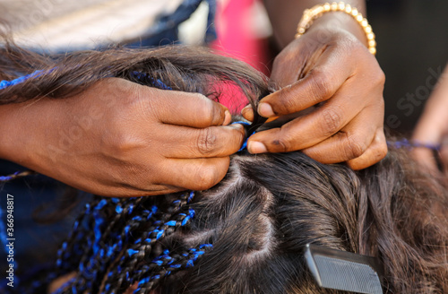 Fotografie Girl braids blue African braids