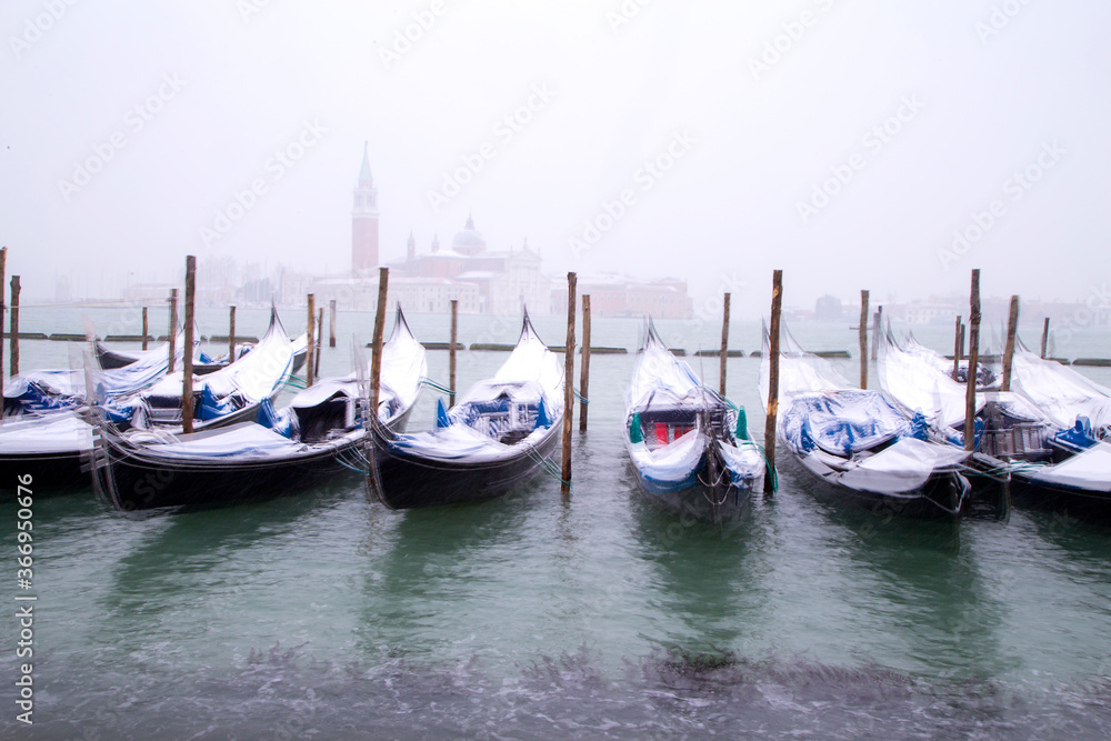Venice in snow with gondolas on Grand Canal, Riva degli Schiavoni, Grand Channel, St. Mark square, San Giorgio island, snowing in Venice, Italy, march 2018, long exposure Venice in snow with gondolas on Grand Canal, Riva degli Schiavoni, Grand Channel, St. Mark square, San Giorgio island, snowing in Venice, Italy, march 2018, long exposure