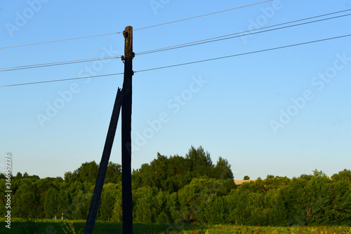 pole with wires against the sky