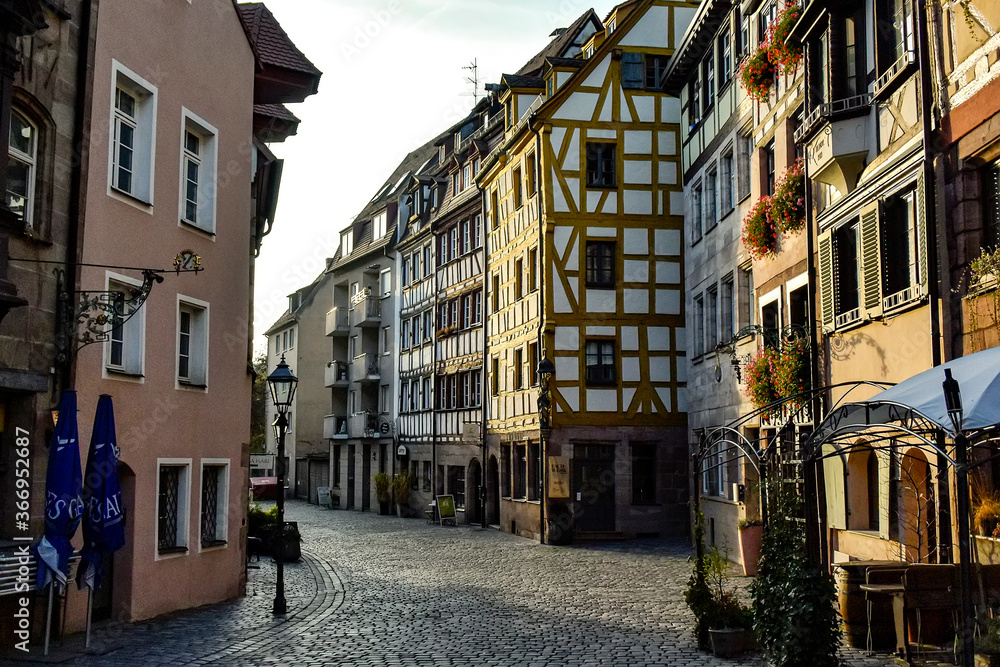 Old fachwerk half-timbered houses on Weissgerbergasse street in historical center of Nuremberg, Germany. October 2014
