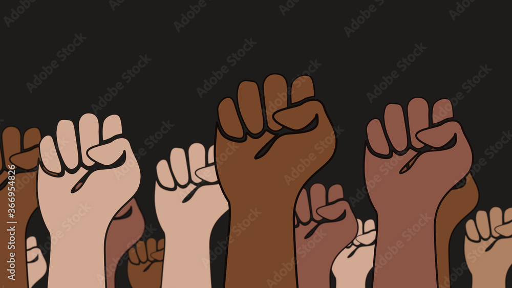 Fists of different skin colors are raised in the air against black background and symbolize cohesion Fists of different skin colors are raised in the air against black background and symbolize cohesion