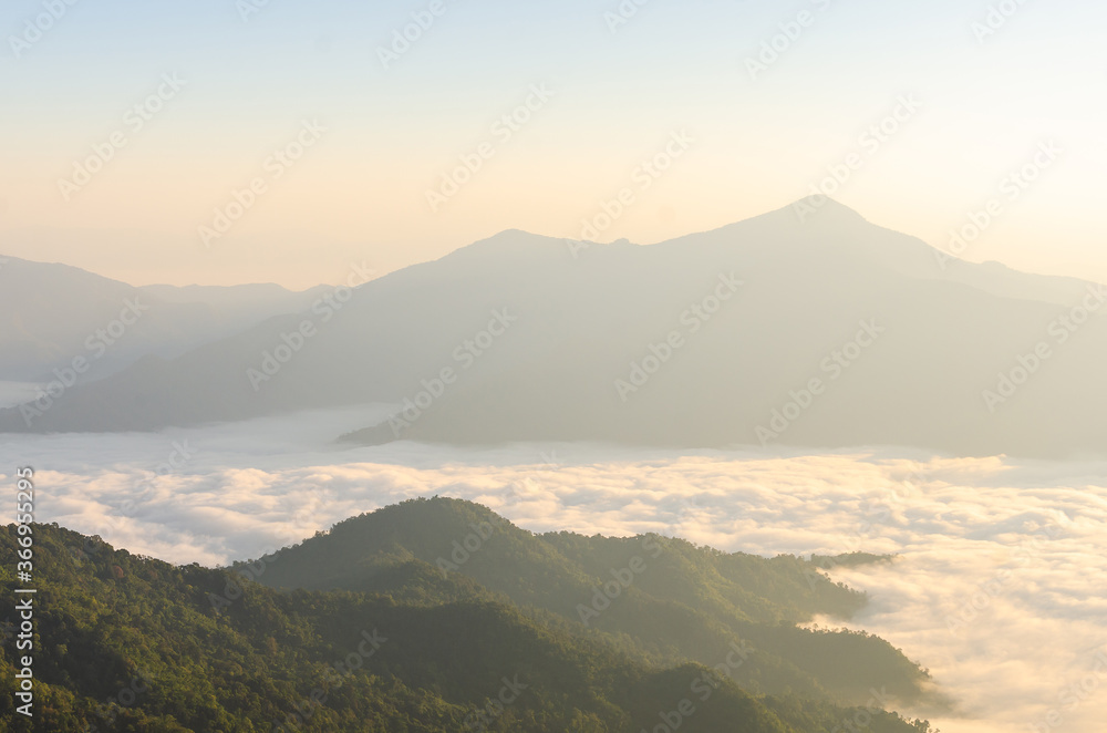 Beautiful view of foggy landscape o top of the mountain and beautiful view sunrise at the morning with clear sky background of nature.