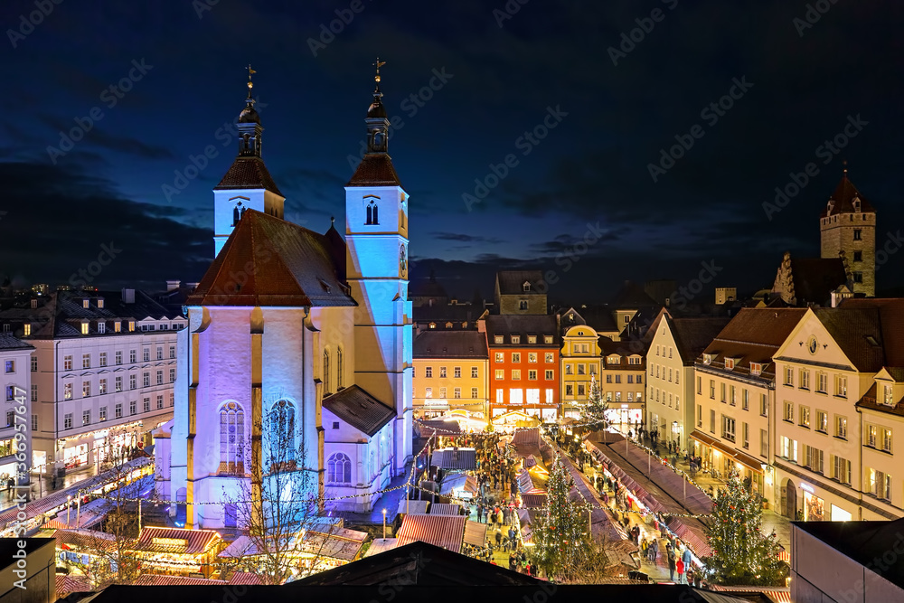 Regensburg, Germany. High angle view of the city's main Christmas market on the Neupfarrplatz (New Parish Square) around the Neupfarrkirche (New Parish Church) in dusk.