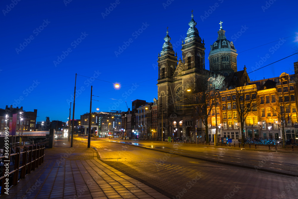 View of Basilica of Saint Nicholas at night time, near the Central railway Station,Amsterdam, Netherlands