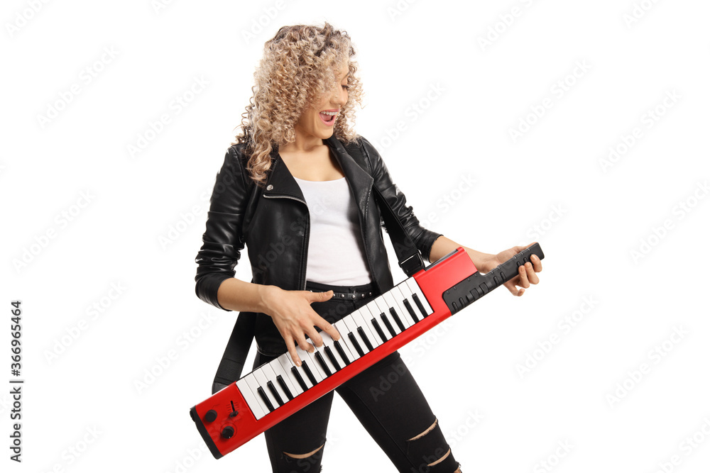Woman playing a red keytar synthesizer Woman playing a red keytar synthesizer