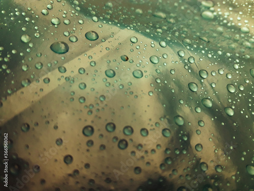 water drops on glass.Water droplets on the green background abstract texture