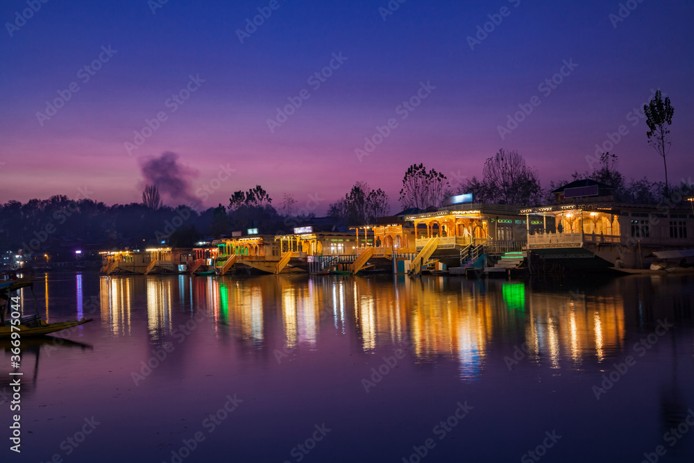 Illuminated Houseboats parked on the bank of Dal Lake in Srinaga