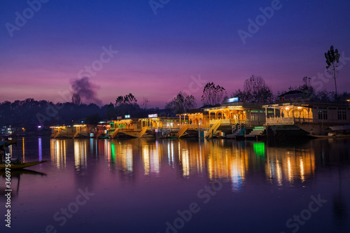 Illuminated Houseboats parked on the bank of Dal Lake in Srinaga
