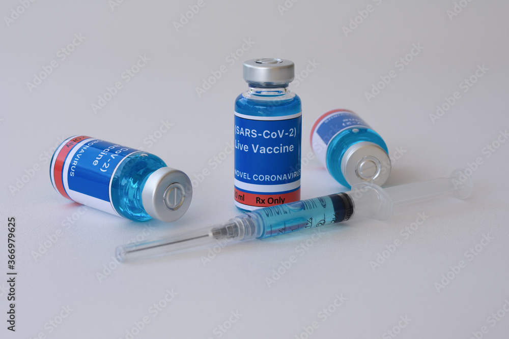 Vaccine and syringe for vaccination. Live vaccine for the SARS-CoV-2 concept. Vaccine and syringe for vaccination. Live vaccine for the SARS-CoV-2 concept.