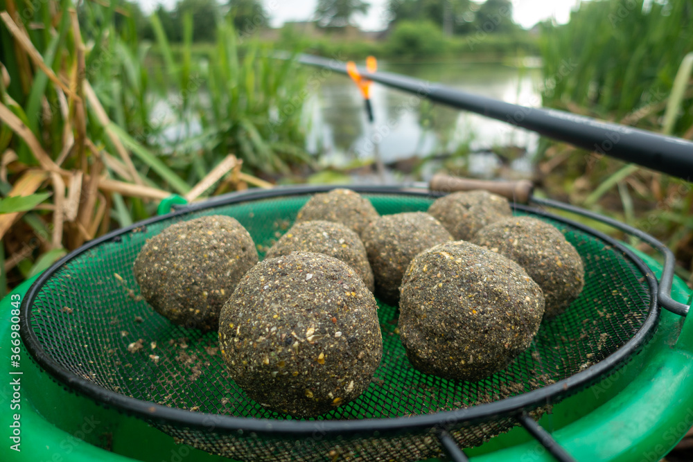 Groundbait balls ready for baiting fish. Fishing groundbait. Kule