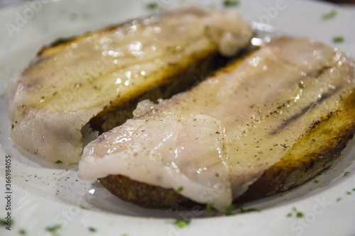 Italian toasted bread with pork lard and pepper. Traditional food photo