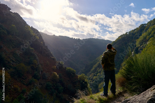 Man looking at a valley in autumn © Antonio