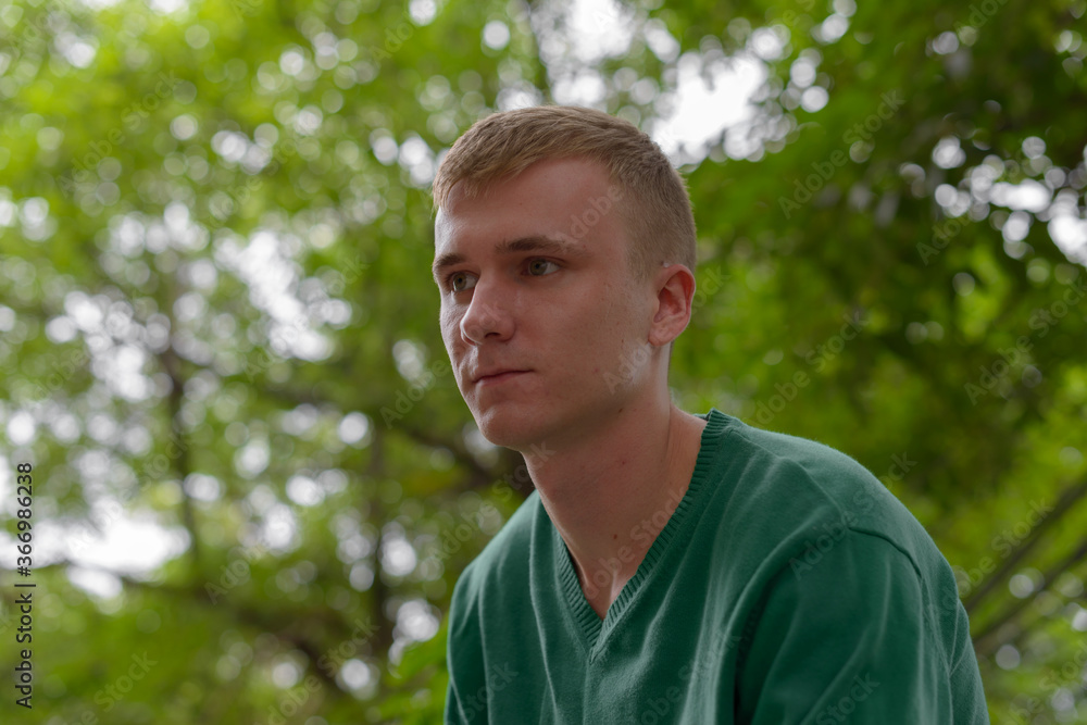 Portrait of young man with blond hair outdoors Portrait of young man with blond hair outdoors