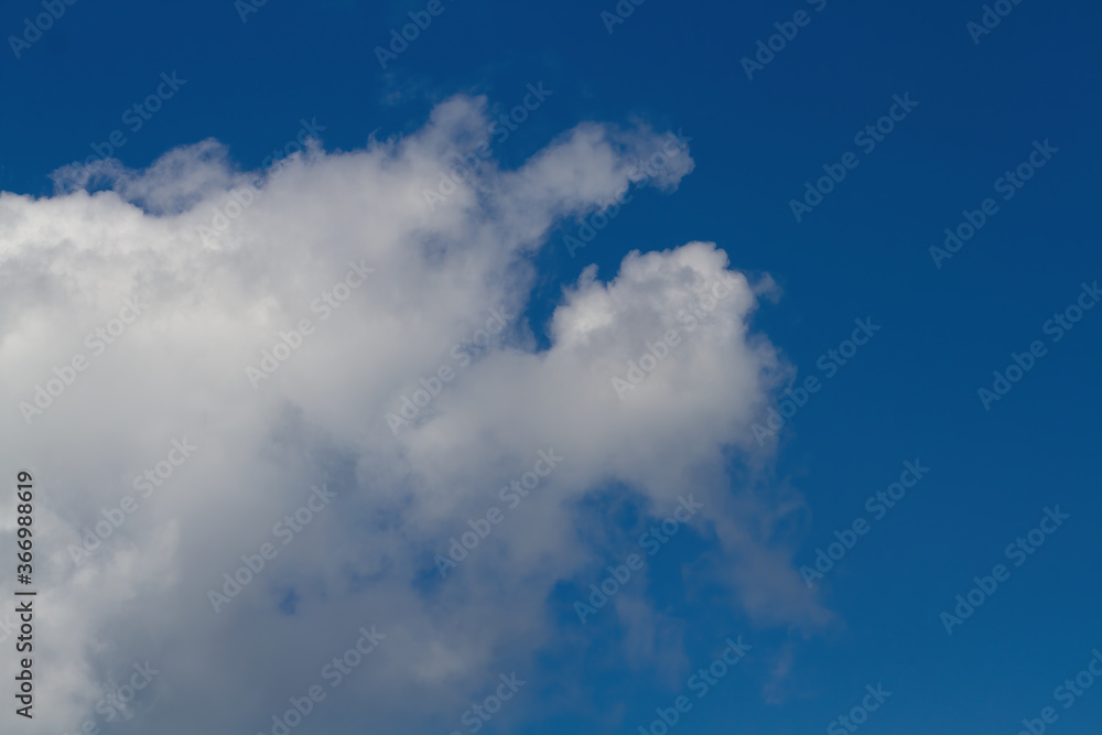 Fototapeta premium White cloud. Blue sky. Delicate background.