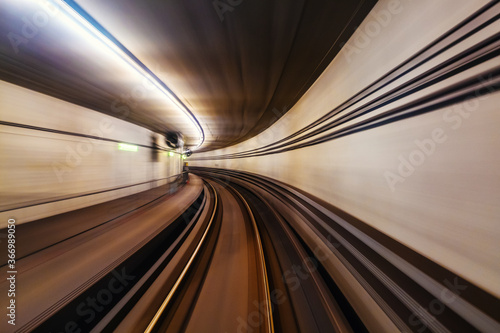Riding the metro with motion blurred tube lines in tunnel