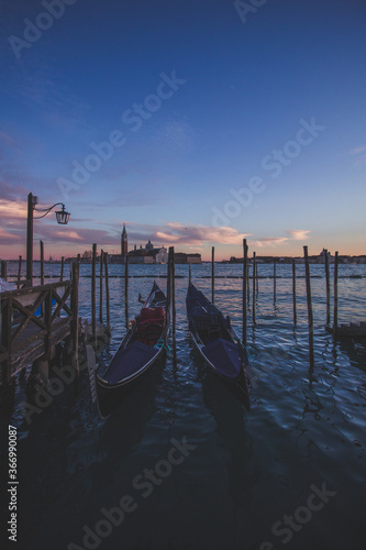 Gondolas At Sunset, Pier In Venice
