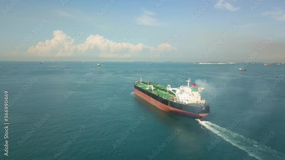 Singapore - October 27, 2019: Aerial shot of sailing crude oil tanker, Singapore Singapore - October 27, 2019: Aerial shot of sailing crude oil tanker, Singapore