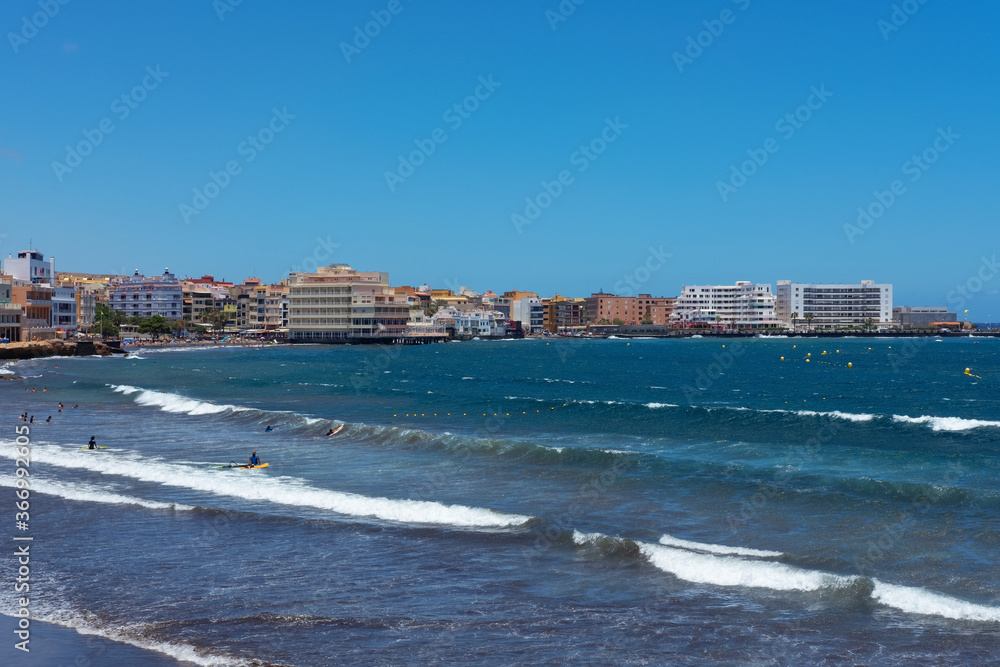  views of the bohemian town in the south east part of the island, with first line residences in front of a popular beach at El Medano, Tenerife, Canary Islands, Spain