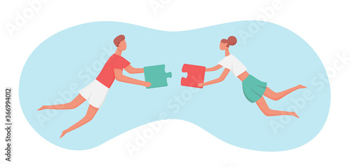Couple holding puzzles and try to match them.