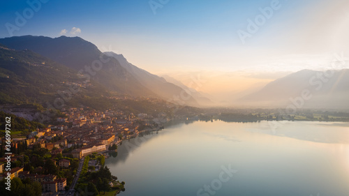 Aerial view of Lake Iseo at sunrise  on the left the city of lovere which runs along the lake Bergamo Italy.