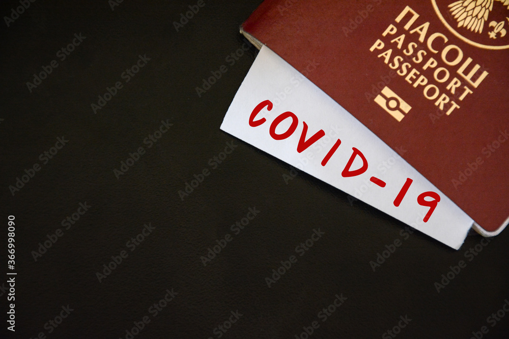 Coronavirus concept background. Passport and note on table with space for text, copy space Coronavirus concept background. Passport and note on table with space for text, copy space
