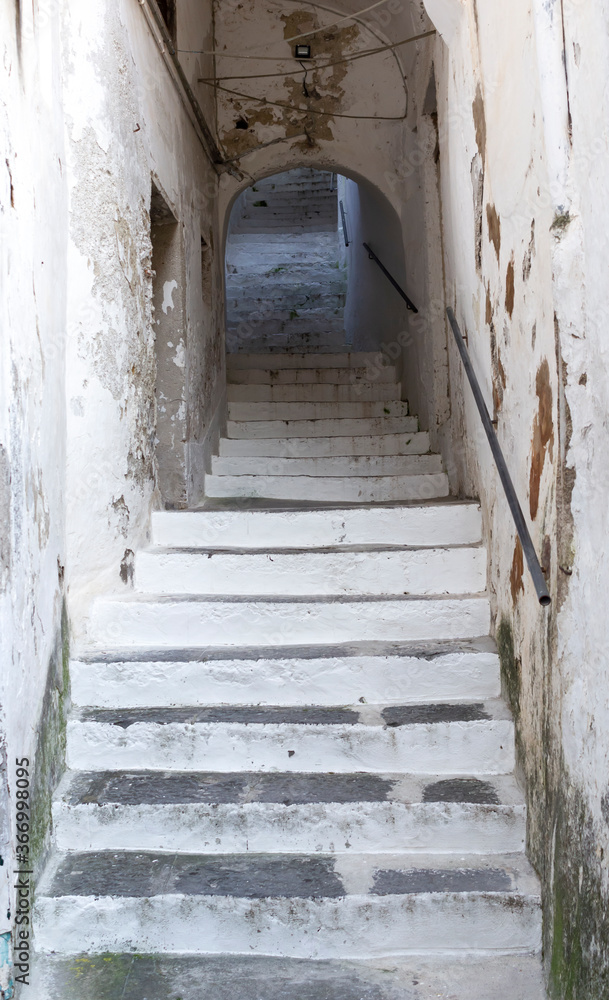Old stone way up staircase in the medieval Amalfi town dwelling in Southern Italy.