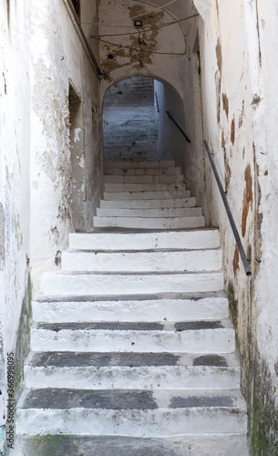 Old stone way up staircase in the medieval Amalfi town dwelling in Southern Italy. © rrrainbow