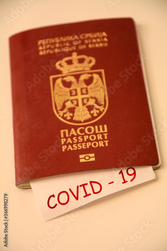 Coronavirus concept background. Passport and note on wooden table