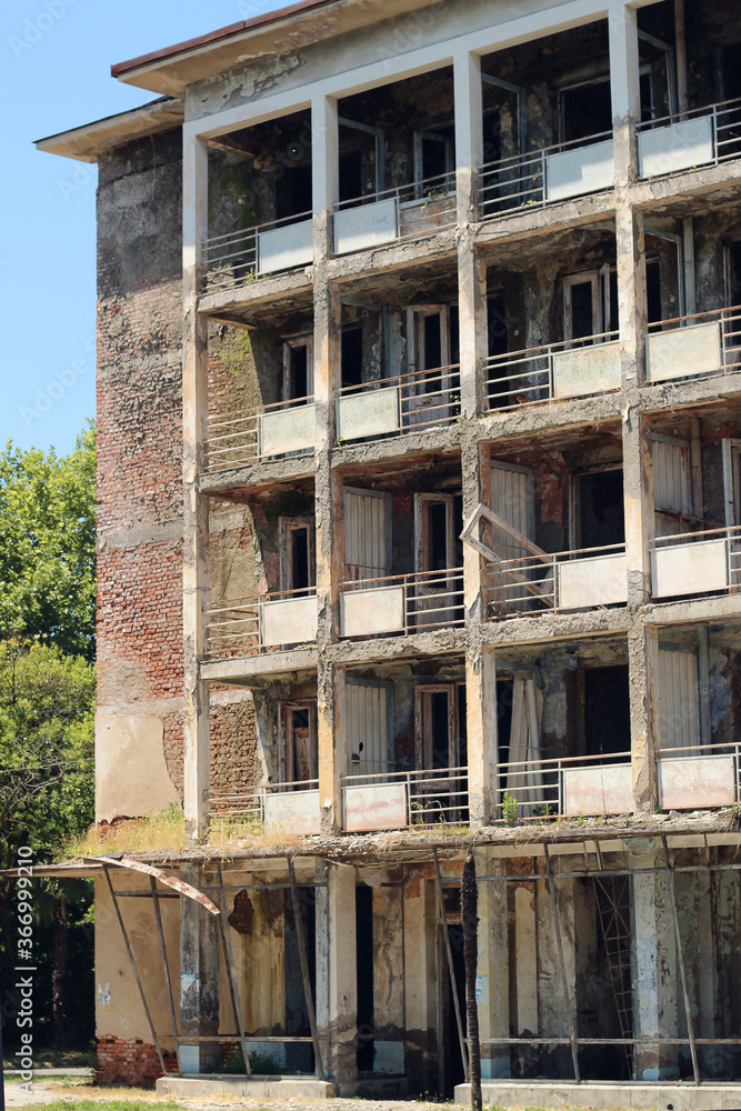 Multi-storey abandoned house without glass in the windows. Multi-storey abandoned house without glass in the windows.