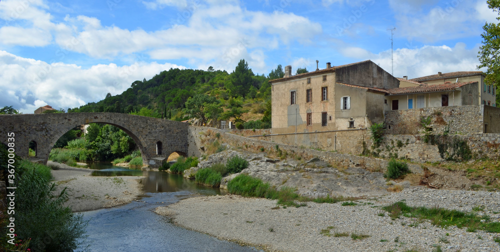 Lagrasse, Aude, Languedoc France. Medieval Bridge river and historic buildings