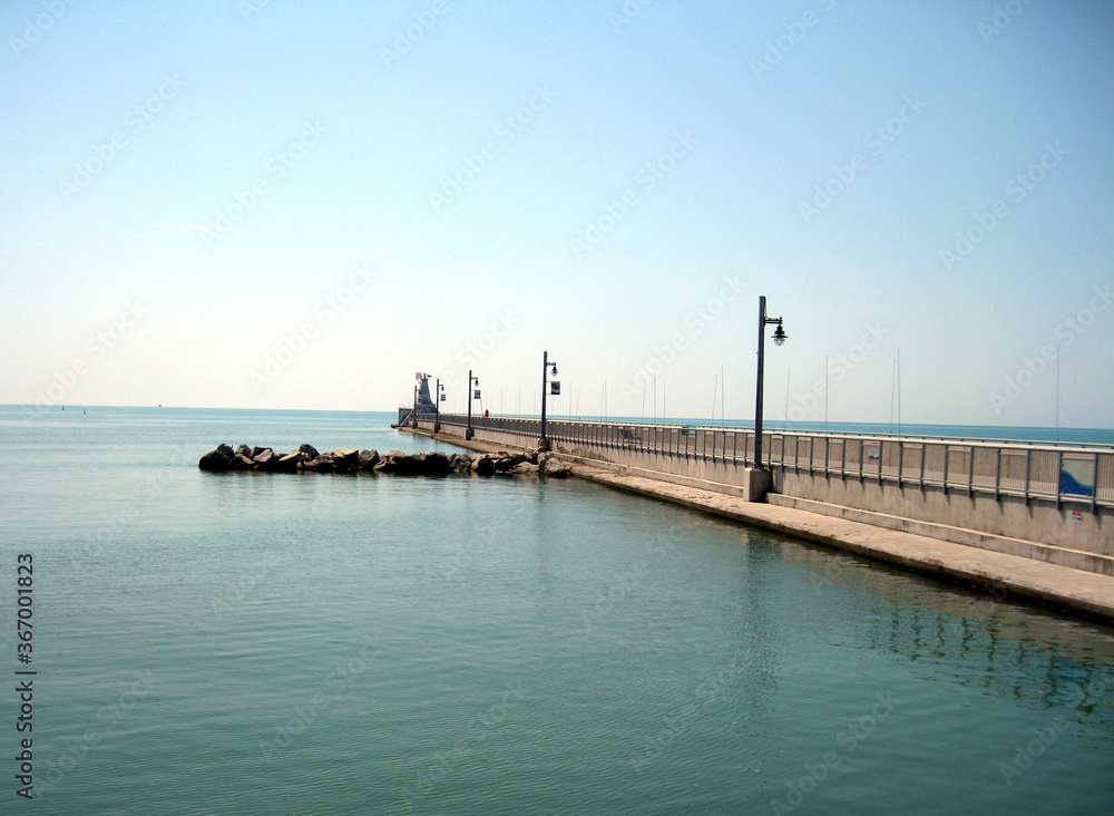 Strolling Pier on a calm summer's day, with space for text.