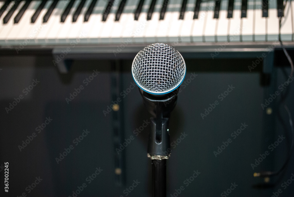 Microphone and piano key in recording studio Microphone and piano key in recording studio